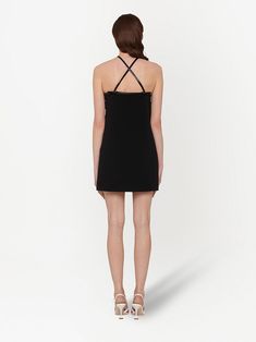 This bold yet refined faille cady dress is characterized by an elegant halter neck with narrow straps that crisscross on the back to accentuate the line. A small bow, an iconic element of the brand, decorates the neck. MinidressHalter neckCenter back zipper closureStraight hem Height: 85 cm Gender: Women Product ID: MF43361YXHF0002 Evening Halter Neck Mini Dress In Elastane, Halter Neck Elastane Mini Dress For Evening, Evening Halter Neck Elastane Mini Dress, Chic Dress With Crisscross Straps And Strappy Back, Evening Halter Neck Mini Dress, Chic Halter Dress With Crisscross Straps, Sleek Evening Dresses With Adjustable Straps, Halter Neck Slip Dress For Evening, Halter Neck Slip Dress With Straps For Evening