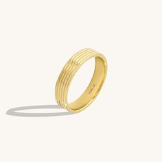 Define your style with the Linear Flat Band Ring a manifestation of modern sophistication. Its sleek, flat design brings a contemporary edge, while the radiant 14K gold exudes timeless allure. A versatile statement, seamlessly blending modernity with understated elegance for a distinctive addition to your jewelry repertoire. - Made in 14k Solid Gold- Band Width: 3.95mm / 0.15 inches- Thickness: 1.25 mm / 0.04 inches - This product comes with iconic Norm Jewels gift box Modern Yellow Gold Jewelry, Modern Rings With Thick Band And Tension Setting, Modern Bands With Smooth Bezel For Everyday, Modern Everyday Bands With Smooth Bezel, Modern Formal Stackable Rings With Wide Band, Modern Wide Band Stackable Rings For Formal Occasions, Contemporary Open Band Rings For Formal Occasions, Modern Formal Stackable Rings, Modern Rings With Polished Finish And Round Band