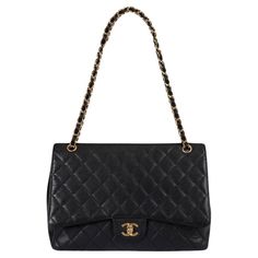 100% authentic Chanel Maxi Classic Timeless Single Flap Bag in black caviar leather featuring gold-tone hardware. Open pocket on the back. Closes with classic CC-turn-lock on the front. Lined in black lambskin with one zipper pocket and one open pocket against the back. Has been carried and shows soft wear to the corners. Overall in excellent condition. Comes with dust bag. Measurements Model A47600 Y01864 Height 23cm (9in) Width 33cm (12.9in) Depth 10cm (3.9in) Drop of the Handle 28cm (10.9in) Chanel Maxi, Structured Shoulder, Flap Shoulder Bag, Bag Measurements, Black Caviar, Black Maxi, Chanel Black, Flap Bag, Timeless Classic