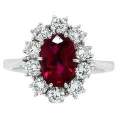 This 18K white gold stunning ring is from our Timeless Collection. It is made of a beautiful oval shape ruby in total of 1.52 Carat decorated by 10 natural colorless round shape diamonds in total of 0.68 Carat. Total metal weight is 4.70 gr. Extraordinary piece for any occasion! The Timeless Collection was inspired by the endless elegance and sophistication of classic high-jewelry, eternising it’s beauty and presenting a selection of classy designs. The intense colours stones give the collection Luxury Oval Ruby Diamond Ring, Luxury Oval Ruby Ring For Anniversary, Luxury Ruby Ring With Oval Center Stone, Luxury Oval Ruby Ring With Prong Setting, Luxury Oval Ruby Ring With Center Stone, Gia Certified Oval Ruby Ring, Luxury Oval Ruby Ring With Halo Design, Gia Certified Classic Ruby Ring With Diamond Accents, Oval Ruby Jewelry With Brilliant Cut For Weddings