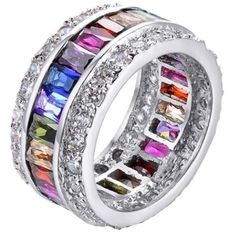 This amazing statement ring is out-of-this-world with color, sparkle, and shine. Featuring a closed circle of various colored emerald cut stones, this ring sparkles every color of the rainbow with your every move. Perfect to wear with any outfit and for any occasion. This is a Wicked Wonders FAVE! Sterling Silver Ring. Cubic zircon multi-colored stones. This is a SIZED ring, please see available sizes. The Bling Ring, Rainbow Rings, Colored Engagement Rings, Trendy Fashion Jewelry, Rings Jewelry Fashion, Trendy Ring, Silver Jewellery Sets, Diamond Cocktail Rings, Cubic Zirconia Rings