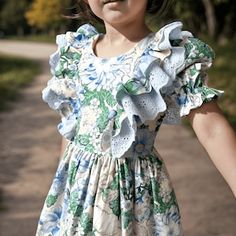 a wonderful spring dress with short sleeves and layered scalloped details on the sleeves, designed with a fabric with a hydrangea flower pattern. it is also a very striking piece for easter. it has a perfect harmony of green blue and white tones. Playful Ruffled Floral Dress For Spring, Playful Spring Ruffle Dress With Ruffle Hem, Playful Ruffle Dress For Spring, Spring Floral Print Twirl Dress With Flutter Sleeves, Spring Twirl Dress With Floral Print And Flutter Sleeves, Spring Floral Twirl Dress With Flutter Sleeves, Cute Spring Twirl Dress With Ruffles, Spring Twirl Dress With Ruffle Hem And Short Sleeves, Short Sleeve Twirl Dress With Ruffle Hem For Spring