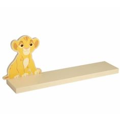 a wooden shelf with a lion on it