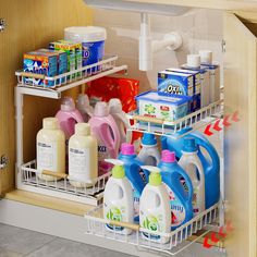 the kitchen sink is filled with cleaning products