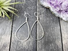 "These super lightweight teardrop hoop earrings feature 40mm x 26mm brass open teardrops. Choose silver-plated or gold-plated! These minimalist geometric earrings will complement any outfit, and are lightweight enough for all day wear! The earrings measure 2.5 inches from the bottom of the teardrop to the top of the ear wires. The gold earrings have hypoallergenic gold-plated surgical steel ear wires, while the silver earrings have hypoallergenic surgical steel ear wires. These earrings are incr Everyday Teardrop Single Earring, Everyday Metal Drop Hoop Earrings, Minimalist Metal Teardrop Hoop Earrings, Minimalist Teardrop Metal Hoop Earrings, Single Long Drop Teardrop Earring For Everyday, Minimalist Hypoallergenic Metal Teardrop Earrings, Metal Drop Hoop Earrings With Ear Wire, Everyday Metal Teardrop Drop Earrings, Metal Teardrop Drop Earrings As Gift