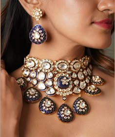 The majestically handcrafted kundan Bridal Wedding necklace set is an ode to the Indian tradition and intricate work handcrafted by the artisans. The bridal necklace embedded with high grade kundan and  hanging is a masterpiece inspired by Sabyasachi jewelry. The kundan earrings paired with the necklace are perfect for all the beautiful brides-to-be! Pair this replica of an ancestral jewelry necklace set with your traditional ensembles and create a look to remember. Necklace Closure - Adjustable Dori Earrings Closure - Push Back Style Tip - This pretty is made for a modern-day woman who has her heart in the little details of her traditional heritage. A perfect fit for a bride who is looking for a little whimsical charm and oodles of opulence with a hint of grandeur. Customized orders takes Luxury Chandbali Necklaces For Wedding, Luxury Traditional Kundan Necklace For Marriage, Blue Meenakari Jewellery, Luxury Meenakari Sets For Reception, Luxury Blue Kundan Necklace For Weddings, Blue Kundan Necklace With Intricate Design For Festive Occasions, Festive Blue Kundan Necklace With Intricate Design, Temple Jewelry With Meenakari For Party, Temple Jewelry Meenakari For Parties