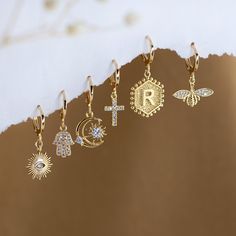 "Dainty Everyday Ear Stack Set, Personalized Initial Earrings, Evil Eye Cross Bee Hamsa Charm Huggies, bridesmaid gift, gold hoop earrings ✨These earrings feature a charm of your choice hanging from a dainty 18k Gold Plated huggie hoop. These hoops are sold as SINGLES, or by PAIRS - both options are available to select from the 2nd drop down menu. Mix & match these earrings to create fun and unique pairs! * Bezeled Moonstone Hoop Available to Purchase HERE: https://www.etsy.com/listing/125321249 Gold Charm Earrings For Gift, Gold Earrings With Charms As A Gift, Gold Earrings With Charms For Gift, Gold Crystal Pierced Earrings As Gift, Gold Crystal Single Earring As A Gift, Gold Crystal Pierced Earrings For Gift, Gold Plated Charm Earrings As Gift, Gold Dangle Hoop Earrings For Wedding, Gold Hoop Earrings With Charms As Gift