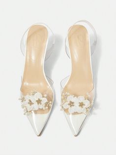 These Floral Clear Heel Pumps are the perfect addition to your summer vacation wardrobe. Featuring an elegant design and a clear heel, these shoes will elevate any outfit. Whether you're strolling through the city or lounging on the beach, these shoes will provide both style and comfort. Details : Pearls Color : White Toe : Point Toe Heel Height : Mid Heel Upper Material : TPU US Size Ball Girth Foot Length Heel Height US5 EUR35 8.1 8.7 3.1 US6 EUR36 8.3 8.9 3.1 US6.5 EUR37 8.5 9.2 3.1 US7 EUR38 White High Heel Sandals With Clear Strap, White Open Toe Heels With Clear Strap, White Jelly Sandals With Round Toe For Party, White Heels With Clear Strap For Party, White Synthetic Jelly Sandals For Party, White Party Heels With Clear Strap, Spring Clear Closed Toe Jelly Sandals, Spring Clear Closed-toe Jelly Sandals, Clear Closed Toe Jelly Sandals For Spring