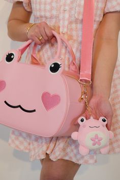 Sakura season is here! Our super soft and squishy Sakura Frog Bag Charm is the sweetest pink complimented by gold hardware. This charm is floral scented to bring a reminder of Spring with you wherever you go! Add as a bag charm, keychain, car charm, the placement possibilities are endless. 🐸🌸 Dimensions: 4 inches tall Cute Pink Everyday Bag Charm, Cute Pink Bags With Keychain, Cute Pink Bag Charm For Everyday Use, Pink School Bag With Keychain, Cute Pink Bag Charm Keychain, Playful Pink Keychains For School, Cute Pink Bag Charm For Gift, Frog Bag, Sakura Season