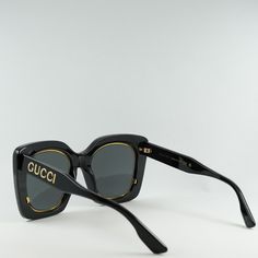 Indulge in the luxury and sophistication of Gucci with the stunning GG1151S 001 Black/Grey sunglasses. These iconic butterfly-shaped frames exude elegance and style, perfect for the fashion-forward woman who wants to make a statement. Crafted from high-quality acetate, the black frame is sleek and modern, while the grey lenses add a touch of mystery and allure. The classic color combination of black and grey never goes out of style, making these sunglasses a timeless addition to your accessory collection. With a lens socket width of 51mm and a bridge size of 23mm, these sunglasses are designed to fit comfortably and securely on your face. The temple length of 145mm ensures a perfect fit for all-day wear, whether you're running errands or lounging by the pool. The Gucci GG1151S 001 Black/Gr Classic Party Sunglasses With Tinted Lenses, Classic Tinted Sunglasses For Party, Classic Tinted Sunglasses For Parties, Designer Matte Black Sunglasses With Uv Protection, Designer Cat Eye Tinted Sunglasses, Chic Matte Black Shield Sunglasses With Gradient Lenses, Designer Matte Black Sunglasses With Uva Protection, Classic Square Frame Sunglasses For Party, Elegant Cat Eye Shield Sunglasses With Tinted Lenses