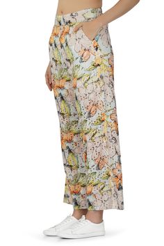 Introducing our Cotton Schiffli All-Over Floral Printed Pants - a delightful fusion of comfort and style that embraces the beauty of floral patterns. These pants are designed to make a statement while ensuring you stay relaxed and chic. Crafted from high-quality cotton Schiffli fabric adorned with an exquisite all-over floral print, these pants capture the essence of natural beauty. The fabric is not only breathable but also adds a touch of elegance to your ensemble. The wide-leg design provides Summer Floral Print Cotton Wide Leg Pants, Cotton Printed Pants For Vacation, Casual Multicolor Floral Print Ankle-length Pants, Summer Floral Print Ankle-length Pants, Summer Floral Print Ankle-length Bottoms, Multicolor Floral Print Ankle-length Pants, Multicolor Ankle-length Floral Print Bottoms, Multicolor Ankle-length Pants With Floral Print, Floral Print Ankle-length Summer Bottoms