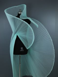 a mannequin made out of pleated material