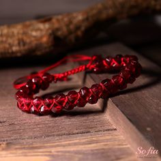 This garnet bracelet is handmade with high-quality rope. It measures about 6.5 inches in length and can be adjusted to fit your wrist size. The bracelet is lightweight and comfortable to wear. It is also easy to match with any outfit, as it has a subtle and elegant design. This bracelet is perfect for anyone who loves healing crystal jewelry, natural stones, or romantic gifts. It is a unique and meaningful gift for yourself or someone special. You can wear it alone or pair it with other jewelry for a stunning look. - Materials: Natural Garnet Stone - Size: fits for 6 ~ 8 inch wrist, adjustable - Handmade With Love and Carefully Manufactured - Due to different light and screen, the color may be slightly different from the picture. - Every natural stone is measured by hand, there may be a sl Red Braided Jewelry As A Gift, Red Braided Jewelry Perfect As A Gift, Red Braided Jewelry For Gifts, Adjustable Round Beads Wristband As Gift, Braided Bracelet Jewelry Gift, Adjustable Wristband With Round Beads As Gift, Adjustable Braided Bracelets As Gift, Adjustable Hand Wrapped Bracelets Gift, Hand Wrapped Adjustable Bracelets Gift