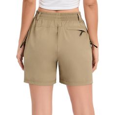 Introducing our Women's 5" Inseam Hiking Shorts, the perfect companion for your outdoor adventures. These high-rise shorts feature a Zipper Multi-Pocket Cargo design, an Elastic and Multifunctional Waist, offering both style and functionality for your hiking excursions. Crafted from a blend of 92% Polyester and 8% Spandex, our hiking shorts provide a comfortable and flexible fit that moves with you on the trails. The high-quality fabric ensures durability and breathability, allowing you to conqu Utility Bottoms With Built-in Shorts For Outdoor Activities, Utility Pants With Built-in Shorts For Outdoor Activities, Outdoor Khaki Pants With Built-in Shorts, Utility Sports Bottoms With Built-in Shorts, Khaki Shorts For Outdoor Activities, Khaki Short Pants For Outdoor Activities, Outdoor Bottoms With Pockets And Short Leg, Short Leg Bottoms With Pockets For Outdoor, Outdoor Activity Shorts With Pockets