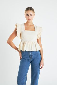 Glow up your wardrobe with this chic Square Neckline Ruffled Top. It features a square neckline sleeveless construction a peplum detail at the bottom and pleated ruffle shoulder for an edgy yet sophisticated look. Dress it up with heeled sandals for a night out or go casual with sneakers. It's perfect for any occasion making it a must-have item in your collection. Get this stylish top now and let it level up your wardrobe! Square neckline Sleeveless Bottom peplum detail Pleated ruffle shoulder R Casual With Sneakers, English Factory, Ruffled Top, Stylish Top, Square Necklines, Ruffle Top, College Outfits, Sophisticated Look, Heeled Sandals