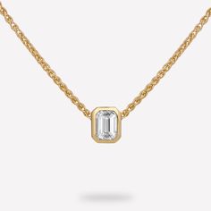 14KT Yellow Gold 1/4 CTW Diamond pendant with chain. The diamond emerald bezel slide pendant is a luxurious and striking piece of jewelry that perfectly balances timeless elegance with contemporary flair. The pendant features a bezel-set emerald cut diamond, and comes with a thin and elegant wheat chain. Its design allows the beauty of the emerald cut diamond to take center stage, while still adding a touch of contemporary flair and versatility. Material : 14KT Gold Pendant Dimension : 5.23x4.24 Diamond Dangle Earrings, Emerald Cut Diamond, Pendant With Chain, Diamond Chain, Emerald Stone, Emerald Cut Diamonds, Center Stage, 14kt Gold, Diamond Solitaire