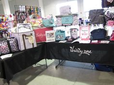 there is a table with many items on it in the store that says thirty one