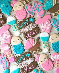 baby shower cookies are arranged on a table