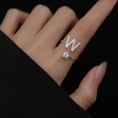 D I A M O N D ∙ I N I T I A L ∙ R I N G The most unique jewelry you can find, the perfect gift for you or your loved one. Introducing our exquisite Letter Initial Ring, a stunning blend of elegance and personalization that elevates your style to new heights. Crafted with the finest materials and attention to detail, this ring is a symbol of individuality W H Y ∙ Y O U 'L L ∙ L O V E ∙ I T• It's dainty and can be worn every day• A special piece you'll treasure for life• High-quality materials and Luxury Initials Engagement Rings, Luxury Diamond Ring With Initials For Gift, Silver Initial Ring With Vvs Clarity For Anniversary, Silver Initial Ring With Diamond Accents For Wedding, Silver Cubic Zirconia Initial Ring For Wedding, Personalized Silver Cubic Zirconia Initial Ring, Personalized Silver Cubic Zirconia Diamond Ring, Personalized Silver Initial Ring With Cubic Zirconia, Silver Vvs Clarity Initial Ring For Anniversary