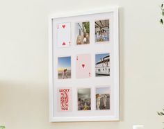 a white framed photo with pictures and hearts on the wall above it is an arrangement of flowers