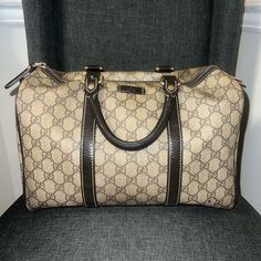 This Gucci Boston Tote Is Crafted From Monogram Canvas And Metallic Leather. It Features Dual Rolled Leather Top Handles, Zip Closure With Leather Tab, Dark Brown Linen Interior Lining With One Open Pocket, And Metallic Tone Hardware. The Bag Is In Used Condition The Monogram Canvas, Interior Fabric And Hardware. The Leather Trims And Handles Have Some Wear And Tears As Shown By The Pictures. Please Reference Pictures. Authenticity Also Shown Measurements Length: 13 In Height:8.5in (Without Handles) Depth: 7 In Handles Height: 4.5in Pre-owned Rectangular Gucci Shoulder Bag, Pre-owned Gucci Shoulder Bag For Travel, Pre-owned Classic Gucci Bags, Luxury Pre-owned Brown Bag, Pre-owned Gucci Leather Bag, Pre-owned Designer Rectangular Bag, Luxury Everyday Pre-owned Shoulder Bag, Elegant Pre-owned Rectangular Bag, Classic Gucci Satchel With Branded Hardware