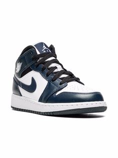 Navy/white/black leather Air Jordan 1 Mid sneakers from Jordan Kids featuring panelled design, signature Swoosh logo detail, signature Air Jordan Wings logo, perforated, round toe, front lace-up fastening, ankle-length, rubber sole and signature Air cushioning. These styles are supplied by a premium sneaker marketplace. Stocking only the most sought-after footwear, they source and curate some of the most hard to find sneakers from around the world.. | Jordan Kids Air Jordan 1 Mid sneakers Air Jordan 1 Kids, Navy High-top Sneakers With Contrast Sole, Jordan 1 Mid Armory Navy, Air Jordan 1 Mid Gs, Jordan Wings, Mid Sneakers, School Bag Essentials, Jordans Girls, Navy Sneakers