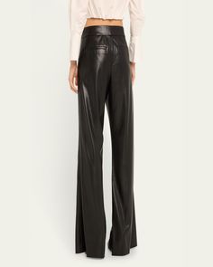 Alice + Olivia "Dylan" pants in fauxleather (polyurethane/polyester)    Approx. 32.25" inseam; 11" rise    High rise    Pintucked front    Back welt pockets    Wide legs    Full length    Hook/zip fly    Lining: Polyester    Dry clean    Imported Sleek Wide-leg Leather Pants For Fall, Sleek Wide-leg Leather Pants, Chic Straight Leg Leather Pants, Sleek Leather Bottoms For Fall, Sleek Leather Wide-leg Pants, Chic Leather Straight Pants, Chic Straight Leather Pants, Elegant Leather Wide Leg Work Pants, Classic Leather Pants For Night Out