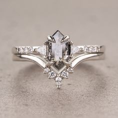 an engagement ring with three stone accents