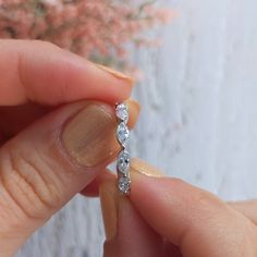 A 2 carat marquise diamond eternity ring in our Anya setting, which incorporates shared prongs for maximum brilliance. Available in 14k and 18k yellow, rose, white gold or platinum. View a 1 carat version of this ring here: https://etsy.me/2QT98ra View a dainty version of this ring here: https://etsy.me/354DVtw More Anya settings: alternating marquise & round, half band: https://etsy.me/2ZA671a alternating marquise & round, full band: https://etsy.me/2WRxClb round, half band: https://ets Diamond White Marquise Cut Diamond Eternity Band, Diamond White Marquise Cut Eternity Band, Diamond Eternity Band With Marquise Cut, Marquise Cut Diamond Eternity Band Gift, Marquise Diamond Eternity Band With Prong Setting, Marquise Cut Cubic Zirconia Eternity Band Gift, Marquise Cut Diamond Eternity Band With Diamond Cut, Marquise Brilliant Cut Eternity Band For Anniversary, Marquise Eternity Band With Diamond Accents For Anniversary