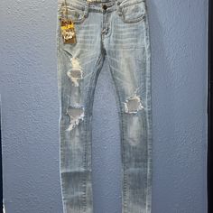 Your Next Fave Jeans - Size 3 (Juniors Sizing), Fits Like A Women’s 26. - Have Some Stretch - Light Wash - Distressed - Regular Rise (Not High-Waisted) - Skinny Fit - Front And Back Pockets - Belt Loops - Zipper And Button Closure Like New With Tags!!! Make An Offer Or Bundle For Extra Savings Trendy Light Wash Distressed Bottoms, Casual Medium Wash Distressed Pants, Urban Fitted Distressed Bottoms, Casual Denim Bottoms With Distressed Detail, Casual Denim Bottoms With Holes, Urban Distressed Mid-rise Pants, Urban Mid-rise Distressed Pants, Urban Style Ripped Medium Wash Bottoms, Fitted Distressed Light Wash Bottoms