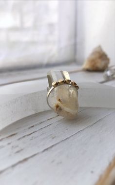 "*Orders placed after 6/1 will not ship until the week of 6/14 as I'll be out of the studio. Thank you for your patience and take advantage of the discount while you wait. Yay Looove this new \"golden nugget\" design! Either 14k solid gold or brass for a more affordable option (yay!) \"nuggets\" have been formed by melting metal into organic shapes and soldered to a textured sterling silver ring band with hammer texture. So dainty and sweet and perfect for stacking! I hope you love it as much as Faceted Gold Open Ring Jewelry, Gold Faceted Open Ring Jewelry, Handmade Gold Moonstone Ring In Sterling Silver, Heirloom Faceted Gold Jewelry, Unique Gold Rings With Birthstone, Heirloom Nugget Rings As Gift, Unique Faceted Yellow Gold Ring, Unique Gold Crystal Ring, Unique Faceted Gold Rings