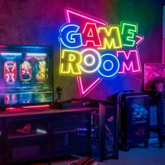 a gaming room with neon signs and video games