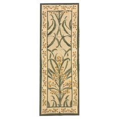 a beige and green rug with an ornate design on the bottom, in front of a white background