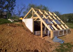 a house being built on top of dirt