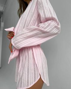 Experience ultimate comfort and style with our Luxurious Cotton Floral Embroidered Pajama Set. Crafted from pure cotton, this exquisite set features delicate floral embroidery in a charming pink hue. The set includes a long-sleeved open-front cardigan with a classic collar and matching short pants, making it perfect for lounging in style during the cooler autumn evenings. Elevate your sleepwear collection with this luxurious ensemble.Key Features:Premium Cotton Fabric: Made from high-quality cotton, this pajama set offers exceptional softness, breathability, and durability for a comfortable night's sleep.Elegant Floral Embroidery: Delicate floral embroidery adds a touch of sophistication and femininity to the ensemble, making it a stylish choice for bedtime or relaxation.Versatile Design: Feminine Cotton Loungewear Sets, Pink Long Sleeve Matching Set Sleepwear, Pink V-neck Sets For Pajama Party, Cotton Beach Sets With Floral Embroidery, Beach Sets With Floral Embroidery In Cotton, Feminine Pink V-neck Set, Feminine Long Sleeve Sets For Daywear, Embroidered Beach Sets For Spring, Cotton Floral Embroidered V-neck Sets