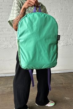 Experience the ultimate in convenience and sustainability with our Upcycled Packable Backpack in Teal, perfect for your everyday transit needs. Made from high-quality sustainable materials, this backpack is not only functional but also environmentally friendly. Details: Sustainable Packable Backpack Padded Straps Fold into pocket Fabric Content: Upcycled Nylon, 3-D Knit, Upcycled Chaco® Straps Waste Diversion: 0.6 lbs. Dimensions: 19"L X 4"W X 12" H Note: Each colorway is extremely limited in av Green Backpack With Water Bottle Pocket, Functional Green Backpack With Water Bottle Pocket, Green Backpack With Water Bottle Pocket For Everyday Use, Green Everyday Backpack With Water Bottle Pocket, Nylon Commuting Bag With Water Bottle Pocket, Functional Nylon Backpack With Recyclable Material, Practical Everyday Nylon Backpack, Everyday Practical Nylon Backpack, Functional Recyclable Nylon Backpack