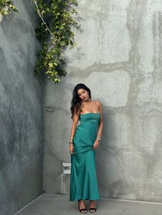 Emerald Waters Strapless Maxi Dress Dive into the deep allure of the coast with this silky emerald green maxi dress. The strapless design is elevated by subtle, pleated detailing across the bodice, creating a perfect blend of elegance and ease. Whether you're walking on the sand or dancing under the stars, this dress f Trendy Going Out Outfits, Emerald Green Maxi Dress, Rehearsal Dinner Looks, White Rehearsal Dinner Dress, Dancing Under The Stars, Green Maxi Dress, Perfect White Tee, Linen Bottoms, Silk Bottoms