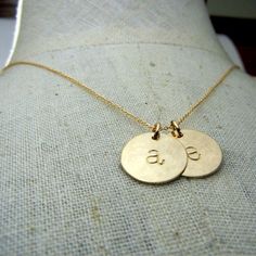 "My two-charm gold letter necklace features two gold initial charms. Each charm and chain is durable 14K gold filled, which will not rub off, chip or flake like plated gold. The gold filled metal on this necklace will last a lifetime with appropriate care. The 20 gauge charms are very sturdy and lovely weight. TO PERSONALIZE: Select your finish and chain length from the drop-down box above, right. Leave your choice of letters in the blank message box at checkout. The two gold letter charms are h 14k Gold Filled Initials Necklace For Everyday, Gold Name Necklace With Round Pendant, 14k Gold Yellow Monogram Charm Necklace, Yellow Gold Monogram Charm Necklace For Anniversary, 14k Yellow Gold Monogram Charm Necklace, 14k Gold Monogram Charm Necklace In Yellow Gold, Gold Name Necklace With Initials, Everyday Gold Initials Name Necklace, Gold Name Necklace With Initials For Everyday