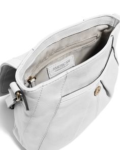 The Ria N/S Crossbody has gently curved lines and tucks for a slim, small crossbody bag that is perfect for everyday use. Genuine leather Exterior: 1 slip pocket under front flap and back slip pocket with magnetic snap Interior: 1 zipper pocket and 2 slip pockets Adjustable strap: 46.25" - 52.25" Dimensions: 11"L x 3.5"W x 9"H Weight approximately: .8 lbs Classic Soft Leather Crossbody Flap Bag, Classic Crossbody Shoulder Bag With Cell Phone Pocket, Classic Crossbody Satchel With Cell Phone Pocket, Classic Crossbody Bags With Pockets, Leather Crossbody Flap Bag With Cell Phone Pocket, Classic Shoulder Bag With Flap And Pockets, Classic Flap Shoulder Bag With Pockets, Classic Shoulder Bag With Magnetic Closure For On-the-go, Classic Crossbody Satchel With Pockets