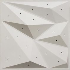 an abstract painting with white and black dots on the bottom half of it, in front of a gray background