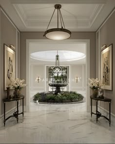 an elegant foyer with marble flooring and chandelier hanging from the ceiling, surrounded by art work