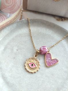 Necklace with chain length 50 cm + 5 cm extension chain Material: gold-plated stainless steel. Pink Heart Charm Necklace With Adjustable Chain, Pink Heart Pendant Metal Jewelry, Pink Heart Pendant Jewelry, Pink Pendant Necklace With Adjustable Chain, Trendy Pink Metal Charm Necklaces, Pink Stainless Steel Jewelry With Charms, Pink Stainless Steel Jewelry, Pink Pendant Charm Necklace, Pink Pendant Charm Necklace With Delicate Chain