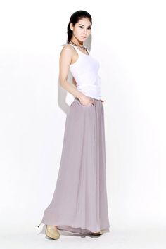 Understated but oh-so elegant, these beautifully streamlined gray chiffon palazzo pants are made in whisper-soft chiffon. Designed to flatter and create a wonderful silhouette no matter what size or shape you are. These chiffon palazzo pants would make a wonderful and slightly alternative mother-of-the-bride wedding outfit. They are so floaty and elegant, just perfect for a wedding party. FEATURES - Chiffon fabric, fully chiffon liner - Right side zipper - Pleated around the waist -Loose fit -Ov High Waist Bottoms For Spring Wedding, High Waist Spring Wedding Bottoms, Elegant Full-length Loose Fit Harem Pants, Chic Full-length Wedding Bottoms, Chic Full Length Wedding Bottoms, Spring Wedding High Waist Bottoms, Spring Wedding High Waist Pants, Chic Stretch Bottoms For Wedding, Chic Bottoms For Spring Wedding