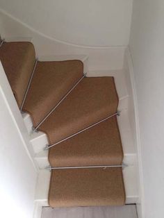 a staircase with carpeted steps leading up to the top