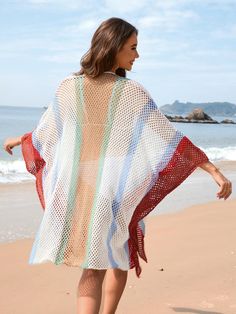 Unleash your inner bohemian with our Calypso Stripe Crochet Kimono! Vibrant stripes and a playful crochet design make this kimono a must-have for any beach getaway. Embrace the carefree, tropical vibes and add a splash of color to your summer wardrobe. (Warning: may cause serious vacation vibes!) Size Guide: Pryscila is 5’6” tall, and has a 33.5” bust, 24.8”waist, & 37.4” hips. She is wearing a S / US 4 / AU 8. This kimono is true to size. Material: 60% Cotton. 40% Acrylic. Key Features: Relaxed fit. Crochet Knit Fabrication. No closure. Maternity Friendly. Care Instructions: Machine wash / Cold hand wash Bohemian Knit Cover-up For Beach Season, Bohemian Open Knit Cover-up For The Beach, White Bohemian Open Knit Cover-up, Red Bohemian Spring Cover-up, Knitted Beachwear Cover-up For Beach, Red Bohemian Cover-up For Vacation, Bohemian Red Cover-up For Vacation, Red Cover-up For Spring Beach, Red Cover-up For Spring Beach Outing