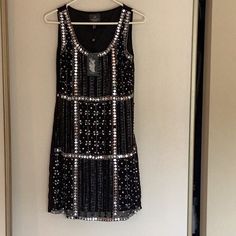 Black A Silver Size 6 Glamorous Beaded Sleeveless Mini Dress, Beaded Sleeveless Dresses For Party Season, Glamorous Embellished Sleeveless Summer Dress, Black Embellished Sleeveless Dress, Embellished Sleeveless Mini Dress For Night Out, Summer Black Embellished Mini Dress, Black Embellished Sleeveless Party Dress, Black Embellished Sleeveless Dress For Party, Chic Sleeveless Beaded Dresses