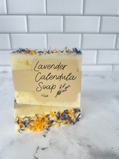 Our handmade Lavender Calendula soap is made is small batches, using only the finest vegetable based oils. Delicate, skin soothing calendula petals are scattered in this cold process recipe! Our recipe was formulated by a registered nurse, and helps severely dry skin. The light scent is soft and light, not overpowering or irritating.  Listing includes 1- 4.5oz bar of handcrafted Lavender calendula soap Calendula Soap, Severe Dry Skin, Lavender Soap Bar, Soap Homemade, Natural Bar Soap, Lavender Soap, Homemade Soap, Vegan Soap, Registered Nurse