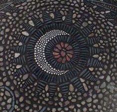 an intricately designed piece of art is shown in this image, it appears to be made out of stones