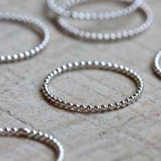 Sterling silver bead wire stacking rings. A set of 6 from Praxis Jewelry $48.00 Gold Circle Ring, Beaded Stacking Rings, Jewelry Mexican, Simple Silver Jewelry, Bead Wire, Engagement Rings Vintage Halo, Jewelry Logo, Flower Engagement Ring, Silver Jewelry Design