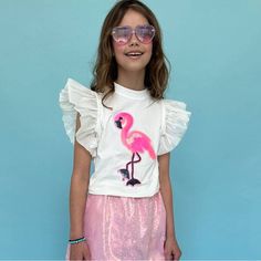 Adorable T-Shirt Featuring A Vibrant Beaded Flamingo Design. Decorated With Sparkling Sequins For A Playful And Eye-Catching Look. Soft Ruffle Sleeves Add A Touch Of Elegance And Fun. Made From Comfortable And Breathable Fabric, Perfect For All-Day Wear. Ideal For Casual Outings, Playdates, And Adding A Pop Of Color To Any Outfit. Material & Care: Fabric: High-Quality Cotton Blend With Sequin Embellishments. Care Instructions: Hand Wash Cold. Lay Flat To Dry. Do Not Bleach Or Iron Directly On Th Summer Pink Flamingo Print Top, Playful Spring Party Tops, Pink Flamingo Print T-shirt For Summer, Playful Summer Party Tops, Cute Pink Ruffled T-shirt, Pink Butterfly Sleeve Tops For Summer, Trendy Ruffled T-shirt For Summer, Trendy Summer Ruffled T-shirt, Trendy Summer T-shirt With Ruffles